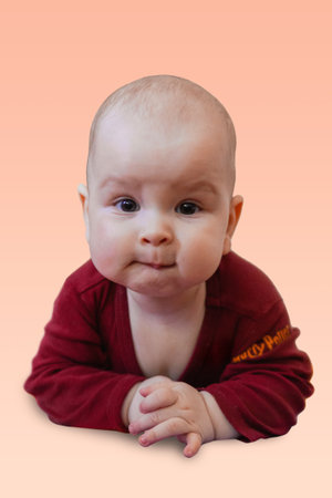 Cute baby crawling on the floor looking to the camera