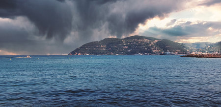 Storm clouds and island, storm Passing over the ocean, dramatic clouds