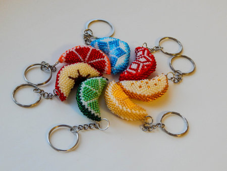 Colorful fruit key chains on a white. Bead colorful key chains on a white background