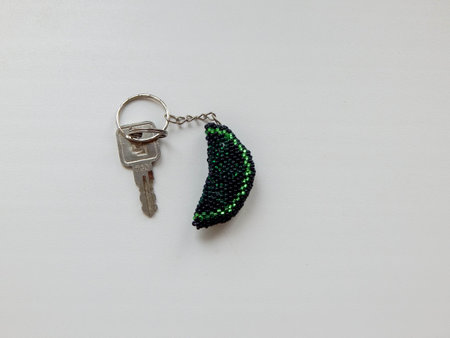 Bead colorful key chain on a white. Colorful bead key chain on a white background