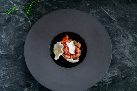 Tuna salad with chips in a black plate. View from aboveの写真素材
