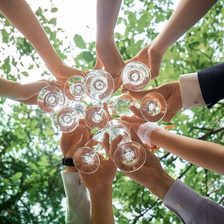 Wedding glasses filled with champagne celebration happinessの写真素材