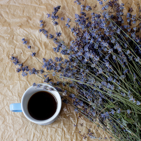 Lavender with coffee on rumpled paper backgroundの写真素材