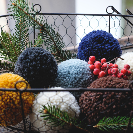 pompon from the hats in the basket like Christmas decorationsの写真素材