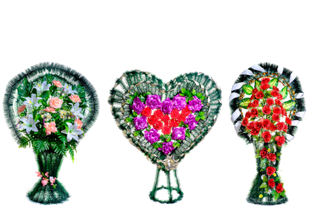 Colorful flower arrangement wreath for funerals isolated on whiteの写真素材