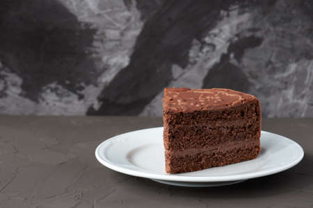 A piece of brown cake isolated on the black backgroundの写真素材
