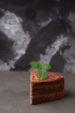 A piece of brown cake isolated on the black backgroundの写真素材