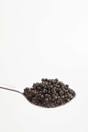 Black caviar close up isolated white backgroundの写真素材