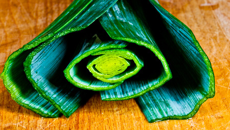 leek on wooden tableの写真素材