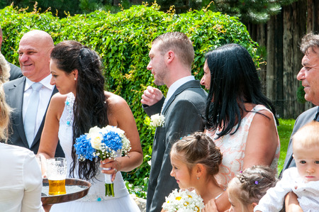 Prague, Czech Republic, July 29, 2017, the bride groom and guests at a rural wedding dayのeditorial素材