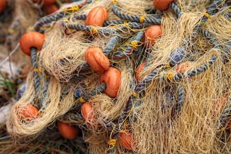 Close-up of a fish net on a beach after fishingの写真素材