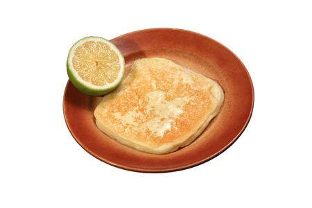 fried yellow cheese served with lemonの写真素材