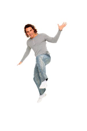 portrait of young man jumping isolated on a white backgroundの写真素材