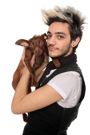 young man posing with pinscher isolated on a white backgroundの写真素材