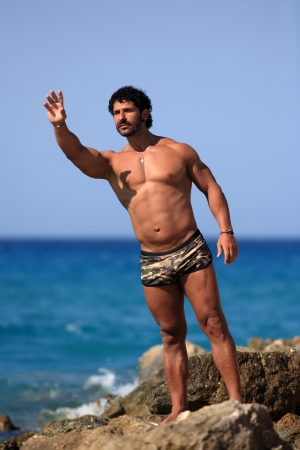 portrait of a handsome guy at the beachの写真素材