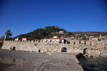 big stone wall of a fort close to the seaの写真素材
