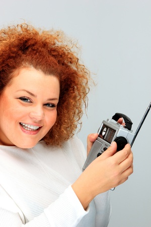 pretty girl with portable radio listening musicの写真素材