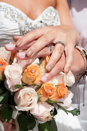 hands of wedding couple, shows his ringsの写真素材