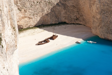 beautiful white beach with shipwreck in a greek islandの写真素材