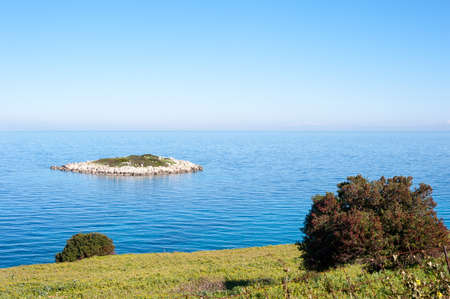 beautiful small island close to the landの写真素材