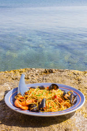seafood with pasta by the sea in a greek islandの写真素材