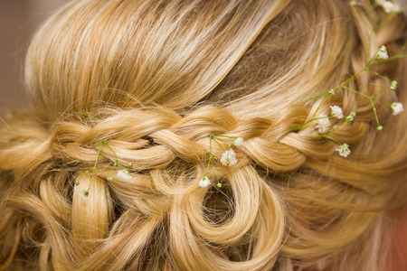 closeup of a bride's wedding hair style with flowersの写真素材