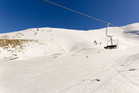 ski lift on the slope of a big ski resortの写真素材