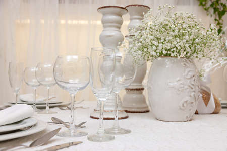 set up of a wedding table decorated with flowers