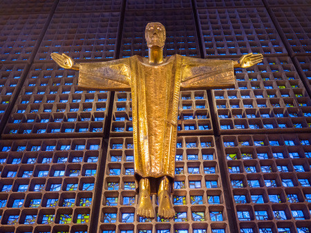 BERLIN,GERMANY - JANUARY 3, 2016: Interior of the memorial church with the gold statue of Jesus and the wall made from blue glass piecesのeditorial素材