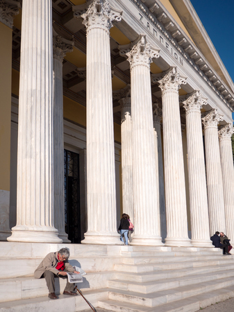 ATHENS, GREECE - MARCH 28, 2016:The Zappeion Hall and people enjoying the sun by sit in the entrance, Athens, Greeceのeditorial素材