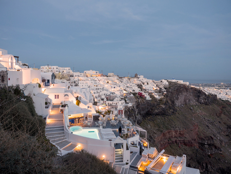 The small white houses with lights late in the afternoon in Santorini island in Cyclades,Greeceの写真素材