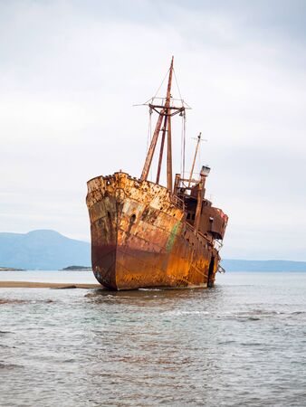 Small shipwreck on the beach left there for years, Gytheio, Greeceの写真素材