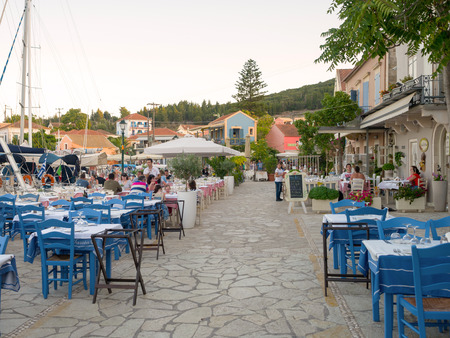 FISKARDO, GREECE - AUGUST 20, 2016: The port of Fiskardo village with greek restaurants in Kefalonia islandのeditorial素材