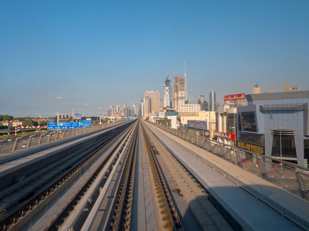 DUBAI,UAE - DECEMBER , 2017: Railway line in Dubai metro with view of the skycrapers on the background in a sunny dayのeditorial素材
