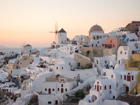 SANTORINI, GREECE- APRIL 13, 2017:People watch the sunset in Santorini island in Cyclades, Greeceのeditorial素材
