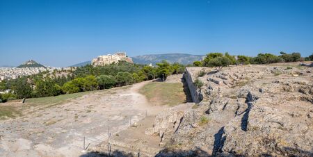 The view of Parthenon temple and the Acropolis hill from Pnyx in Athens, Greeceの写真素材