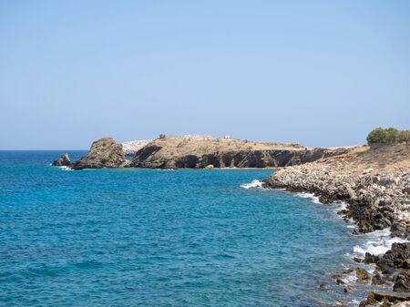 Rocky beach and blue sea in Folegandros island of Cyclades, Greeceの写真素材