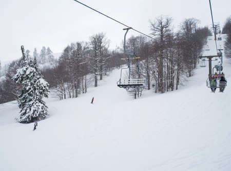 Chair lift on the slope of a big ski resort Vasilitsa in Grevena, North Greeceの写真素材