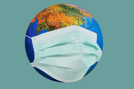stay protected stay at home. Protect the globe cover yourself with mask.の写真素材