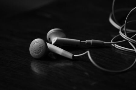 White headphones on a black backgroundの写真素材