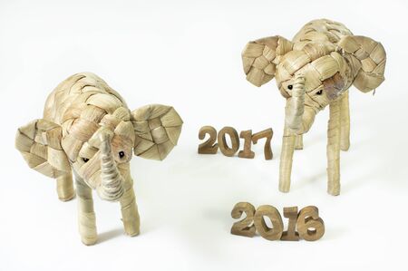 Happy New Year 2016 on white background concept, elephant rattan and wood number ideaの写真素材