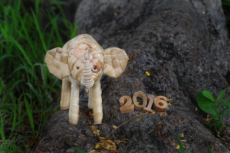 Happy New Year 2016 concept, elephant rattan handmade and wood number ideaの写真素材