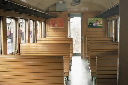 BANGKOK THAILAND - October 2015: Cabin of public train with wooden seat at Bangkok Railway Station Hua Lamphong in Thai language. Hua Lamphong is main train station in Bangkokのeditorial素材
