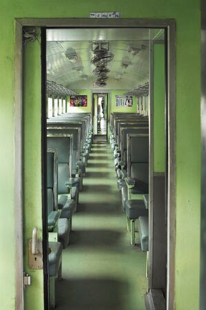 BANGKOK THAILAND - October 2015: Cabin of public train with wooden seat at Bangkok Railway Station Hua Lamphong in Thai language. Hua Lamphong is main train station in Bangkokのeditorial素材