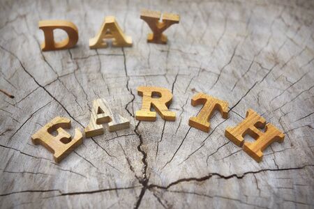 Earth day word on wood background, save the earth ideaの写真素材