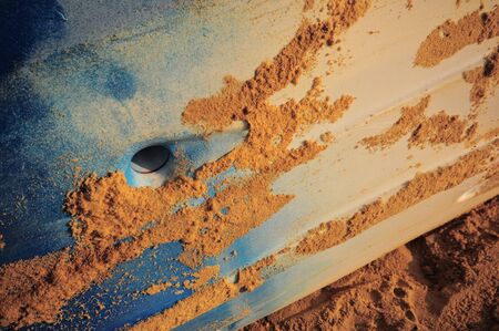 Close-up colourful side view of kayak boat with sand, abstract concept and textured ideaの写真素材