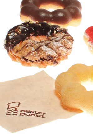 BANGKOK THAILAND - DECEMBER 11 :  Many Pon De Rings donuts of mister donuts brand with napkin on white background in BANGKOK THAILAND on DECEMBER 11, 2013のeditorial素材