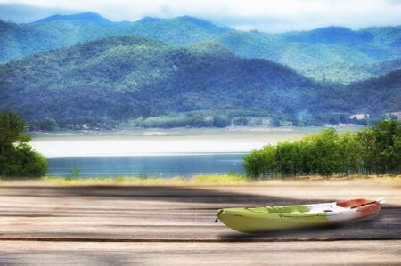 Wooden plank with mountain landscape view background, happy summer holiday concept and display products ideaの写真素材