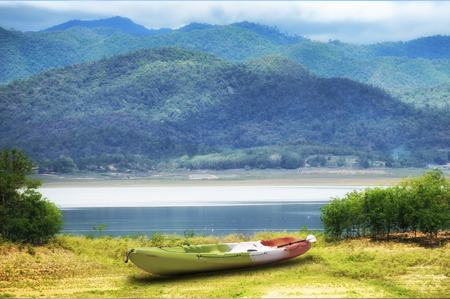Mountain landscape view with kayak boat, happy summer holiday concept and nature ideaの写真素材