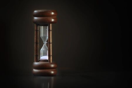 Classic sand-glass on dark background, Time management concept and Time up idea